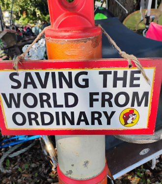 A sign in front of Nature’s Garden
